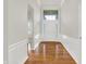 Elegant foyer with hardwood floors, white trim, and a transom window above the front door at 16130 Matlock Cir, Westfield, IN 46074