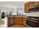 Well-lit kitchen with granite countertops, stainless appliances, and ample cabinet space at 16130 Matlock Cir, Westfield, IN 46074