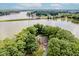 Panoramic aerial view of lakefront property surrounded by mature trees offering privacy and scenic views at 18 Point Ln, Arcadia, IN 46030