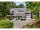 Spacious backyard featuring a large deck, multiple seating areas, and lush landscaping with mature trees at 18 Point Ln, Arcadia, IN 46030