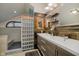 Modern bathroom with double sinks, stylish fixtures, and a glass block partition at 18 Point Ln, Arcadia, IN 46030