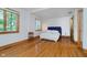 Bright bedroom with hardwood floors, and large windows that let in natural light and showcase the scenic view at 18 Point Ln, Arcadia, IN 46030