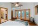 Bright bedroom featuring glass doors with access to the outdoors and natural light at 18 Point Ln, Arcadia, IN 46030