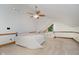 Cozy bedroom with a ceiling fan, built in drawers, and a charming window nook at 18 Point Ln, Arcadia, IN 46030