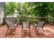 Inviting deck with seating offers picturesque lake views amid lush greenery for serene outdoor living and relaxation at 18 Point Ln, Arcadia, IN 46030