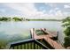 Lakefront dock and boat lift offer direct access to the water, ideal for boating and water activities at 18 Point Ln, Arcadia, IN 46030
