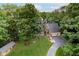 Aerial view of a charming home with a three-car garage, and an expansive lush front lawn at 18 Point Ln, Arcadia, IN 46030