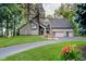 Contemporary home with an attached two-car garage and well-manicured lawn at 18 Point Ln, Arcadia, IN 46030