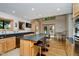 Bright kitchen with granite countertops, hardwood floors, island seating and access to lake views at 18 Point Ln, Arcadia, IN 46030
