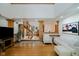 Bright living room featuring a spiral staircase, hardwood floors, and comfortable seating, perfect for relaxation and entertaining at 18 Point Ln, Arcadia, IN 46030