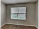This room features neutral walls, carpet flooring, and a window at 19533 Chip Shot Rd, Noblesville, IN 46062
