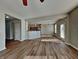 Open-concept living room with new hardwood floors seamlessly connected to the kitchen and dining area at 19533 Chip Shot Rd, Noblesville, IN 46062