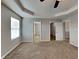 Spacious carpeted main bedroom with walk-in closet and ensuite bathroom access at 19533 Chip Shot Rd, Noblesville, IN 46062