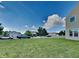 Street view of a home featuring a well-manicured lawn and a clear blue sky with fluffy white clouds at 19533 Chip Shot Rd, Noblesville, IN 46062