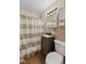 Bathroom features vinyl floor, vanity with granite countertop, toilet and shower at 2017 E Legrande Ave, Indianapolis, IN 46203