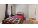 Small bedroom with bed, wood-look flooring, and natural light at 2017 E Legrande Ave, Indianapolis, IN 46203