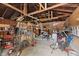 View of an cluttered detached garage with various tools and supplies at 2017 E Legrande Ave, Indianapolis, IN 46203