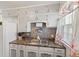 Functional kitchen with ample counter space, stainless steel sink, and tiled backsplash at 2017 E Legrande Ave, Indianapolis, IN 46203