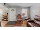 Cozy living room with hardwood floors, a patterned rug, and comfortable seating arrangements at 2017 E Legrande Ave, Indianapolis, IN 46203