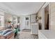 All-purpose room with laundry appliances, door to back yard and wood-look flooring at 2017 E Legrande Ave, Indianapolis, IN 46203