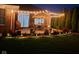Cozy backyard patio with string lights, patio furniture, and landscaped garden at 204 St Andrews Ave, Edinburgh, IN 46124