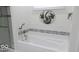 Luxurious bathroom featuring a deep soaking tub with jets and elegant tile accents at 204 St Andrews Ave, Edinburgh, IN 46124