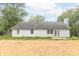 Spacious backyard featuring a fenced perimeter, straw, and access to the home at 2443 S Brandywine Ct, Greenfield, IN 46140