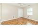 Bedroom featuring laminate floors, a ceiling fan, a large closet, and bright natural light at 2443 S Brandywine Ct, Greenfield, IN 46140