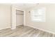 Bedroom featuring neutral walls, hardwood floors, a window, and a closet at 2443 S Brandywine Ct, Greenfield, IN 46140