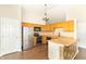 Bright, open kitchen featuring modern appliances, counter seating and hardwood floors at 2443 S Brandywine Ct, Greenfield, IN 46140