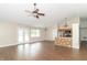 Open-concept living area with hardwood floors and natural light showcasing kitchen at 2443 S Brandywine Ct, Greenfield, IN 46140