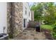 Private backyard with patio and stone detailing is great for relaxing and grilling at 2578 Chaseway Ct, Indianapolis, IN 46268