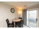 Cozy dining area with a round table, seating for four, and sliding glass door to the outdoors at 2578 Chaseway Ct, Indianapolis, IN 46268