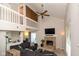 Spacious living room with vaulted ceilings, stone fireplace, and a cozy sectional sofa at 2578 Chaseway Ct, Indianapolis, IN 46268