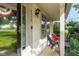 Inviting covered porch with seating area, featuring ample natural light and a welcoming entrance at 2578 Chaseway Ct, Indianapolis, IN 46268