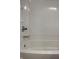 White bathtub with chrome faucet and shower head in a clean bathroom at 2770 Two Worlds Dr, Columbus, IN 47201