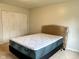 A bedroom featuring new mattress, carpet floors, a window, and spacious closet at 2770 Two Worlds Dr, Columbus, IN 47201