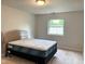 A bright bedroom with a comfortable mattress and a window view at 2770 Two Worlds Dr, Columbus, IN 47201