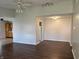 A bright living room connects to the kitchen and dining room, featuring wood floors and modern lighting at 2770 Two Worlds Dr, Columbus, IN 47201