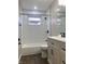 This bathroom features hexagonal tile, modern vanity, and a shower-tub combo at 2822 Tindall St, Indianapolis, IN 46203