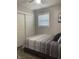 Comfortable bedroom with a window, soft lighting, and closet space at 2822 Tindall St, Indianapolis, IN 46203