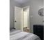 Modern bedroom featuring neutral walls, black dresser, and a round decorative mirror at 2822 Tindall St, Indianapolis, IN 46203