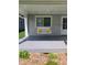 Cozy front porch with a charming white swing and yellow pillows, offering a relaxing outdoor space at 2822 Tindall St, Indianapolis, IN 46203