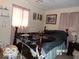 Cozy bedroom with a bed, window, and minimal decor, perfect for a peaceful retreat at 3213 S Cherokee Rd, Muncie, IN 47302
