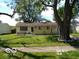 Charming single-story home with mature trees and a well-maintained lawn, perfect for outdoor enjoyment at 3213 S Cherokee Rd, Muncie, IN 47302