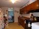 Practical kitchen with classic cabinets and standard appliances, offering a comfortable cooking environment at 3213 S Cherokee Rd, Muncie, IN 47302
