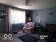 Inviting living room with comfortable seating, soft lighting, and a welcoming atmosphere for relaxation and socializing at 3213 S Cherokee Rd, Muncie, IN 47302