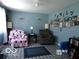 Comfortable living room with seating, lamps, and a Gathering photo display, ideal for relaxation at 3213 S Cherokee Rd, Muncie, IN 47302