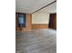 Bedroom showcasing wood paneled walls and flooring at 3216 Memorial N Dr, Elwood, IN 46036