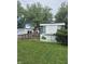 Exterior of a mobile home featuring a ramp and deck at 3216 Memorial N Dr, Elwood, IN 46036
